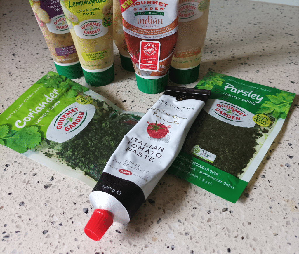 Eight different spice blends and flavouring in squeeze bottles and freeze dried herbs