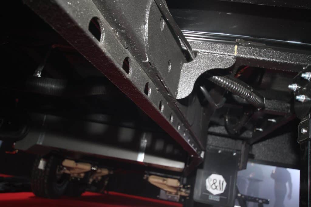 underneath the Titanium WS1 caravan we see a truss chassis with a narrow profile that makes entering the caravan easier without forgoing the design benefits of an all flat floor