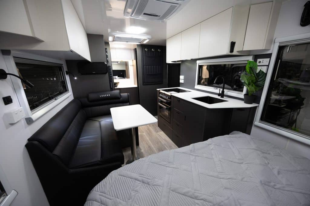The L-shape microfibre leather lounge inside the Legend Trackline.